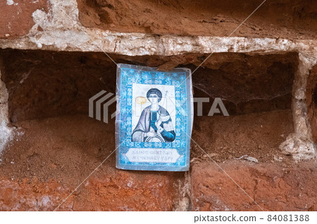 The image of the holy martyr, inserted into a niche in the brick wall. 84081388