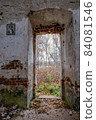 View from the stone doorway of the destroyed church on the autumn landscape. 84081546