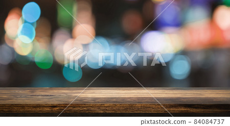 Empty wooden table top with beautiful light bokeh in background for product showing. 84084737