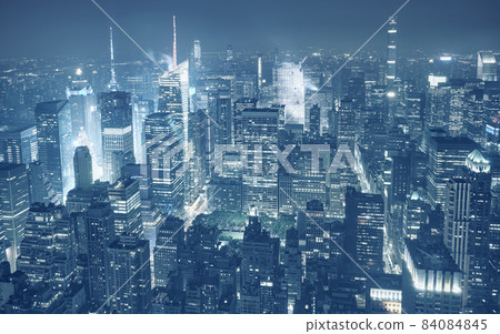 Aerial view of Manhattan at hazy night, color toning applied, New York City, USA. Aerial view of Manhattan at hazy night, color toning applied, New York City, USA. 84084845