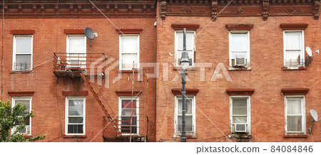 Old brick townhouses in New York City, USA. 84084846