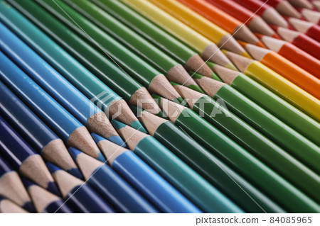 Colourful childrens drawing pencils pointing one another in line Colourful childrens drawing pencils pointing one another in line 84085965