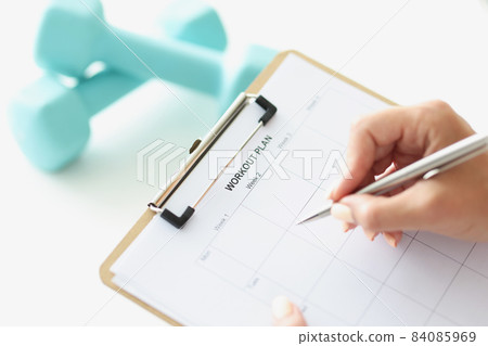 Person make up workout plan of physical activity for month 84085969