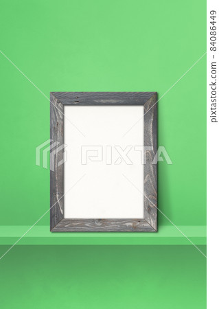 Wooden picture frame leaning on a green shelf. 3d illustration. Vertical background 84086449