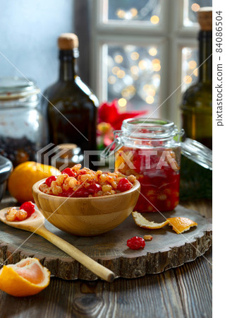 Mixed dried fruits and raisins soaked in spices in rum. 84086504