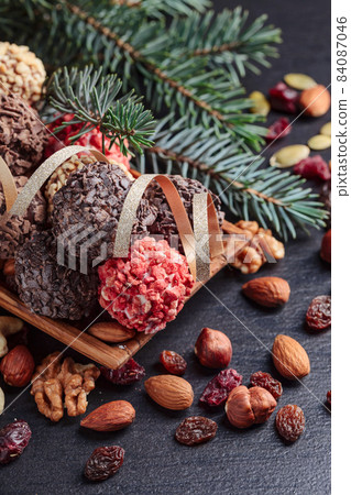 Chocolates and a fir branch. Chocolates and a fir branch. 84087046