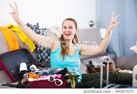 Woman getting ready for holidays Woman getting ready for holidays 84087073