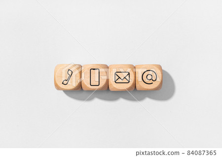 Contact us icon on wooden blocks isolated on gray background 84087365