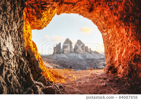 Tre Cime Di Lavaredo peaks in incredible orange sunset light 84087856