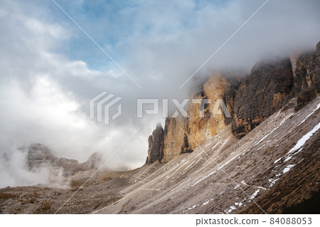 Incredible view of the Three Peaks of Lavaredo in morning fog 84088053