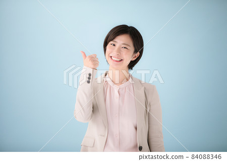 Young female portrait thumbs up 84088346