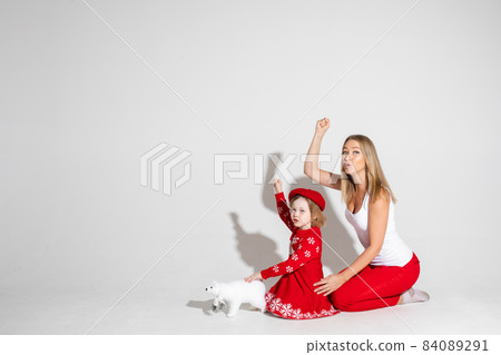 Mom and child with arms with fist up. Mom and child with arms with fist up. 84089291