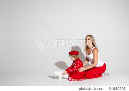 Mom and child with arms with fist up. Mom and child with arms with fist up. 84089292