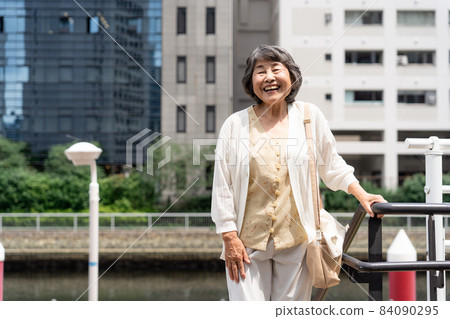 Senior female outdoor smile Senior female outdoor smile 84090295