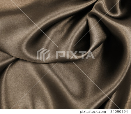 Smooth elegant brown silk or satin texture as abstract background. Luxurious background design. In Sepia toned. Retro style Smooth elegant brown silk or satin texture as abstract background. Luxurious background design. In Sepia toned. Retro style 84090594