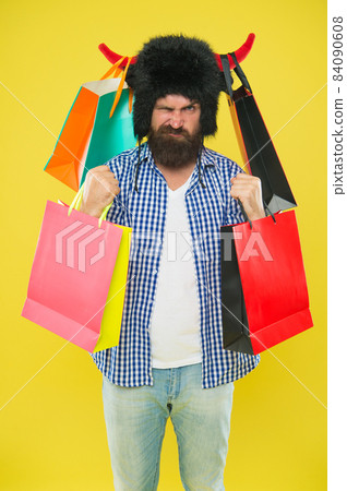 Man mad face wear hat bull with horns. Hipster shopping Man mad face wear hat bull with horns. Hipster shopping 84090608