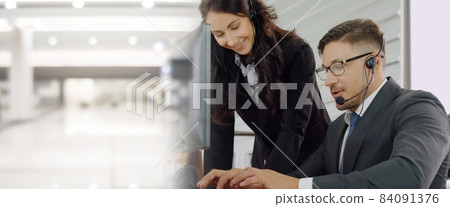 Business people wearing headset working in office broaden view Business people wearing headset working in office broaden view 84091376