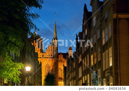 Famous touristic Mariacka street in Gdansk, Poland with view of St Mary's Church at dusk 84091656