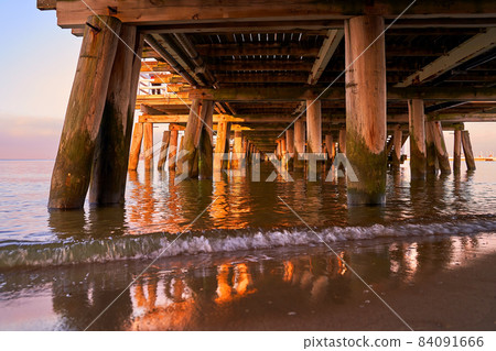 Sopot Pier at dusk. Bottow low angle view of the wooden structure. Sopot Pier at dusk. Bottow low angle view of the wooden structure. 84091666