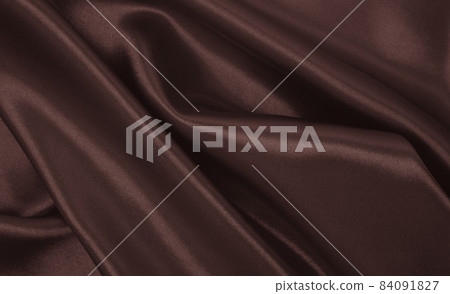 Smooth elegant brown silk or satin luxury cloth texture as abstract background. Luxurious background design wallpaper. In Sepia toned. Retro style Smooth elegant brown silk or satin luxury cloth texture as abstract background. Luxurious background design wallpaper. In Sepia toned. Retro style 84091827