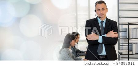 Business people wearing headset working in office broaden view 84092011