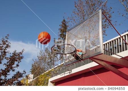 basketball orange ball flies to the hoop at the competition 84094850