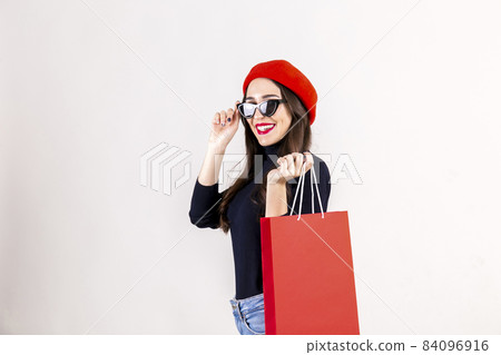 Happy brunette female with long hair in casual outfit posing over isolated white background. 84096916