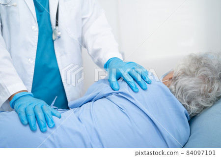 Doctor help Asian senior or elderly old lady woman patient wearing a face mask in hospital for protect safety infection and kill Covid-19 Coronavirus. Doctor help Asian senior or elderly old lady woman patient wearing a face mask in hospital for protect safety infection and kill Covid-19 Coronavirus. 84097101