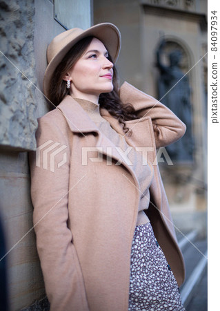 Romantic pretty woman with building behind Romantic pretty woman with building behind 84097934