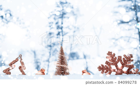Snow Christmas background. Xmas holiday tree, golden balls in new year ornament decoration on white winter snow. Merry Christmas holiday card pattern. 84099278