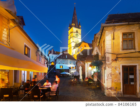 Sibiu streets with Cathedral in evening Sibiu streets with Cathedral in evening 84106165