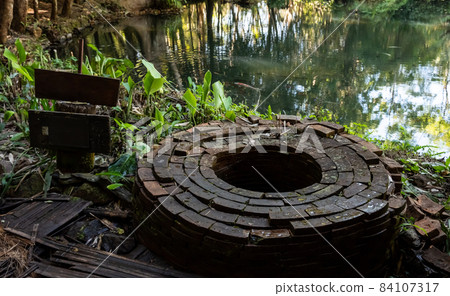 The holy well in the Buddha garden on Doi Chang in Chiang Rai province of Thailand. In the history the water of this well is using for Thai king sacred ceremony (accession to the throne). 84107317