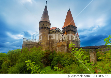 Corvin Castle is on the green mountain 84109256