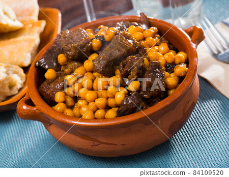 Tasty beef stew with chickpeas closeup 84109520