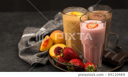 assortment milkshake glasses with fruits chocolate. High quality beautiful photo concept assortment milkshake glasses with fruits chocolate. High quality beautiful photo concept 84110469