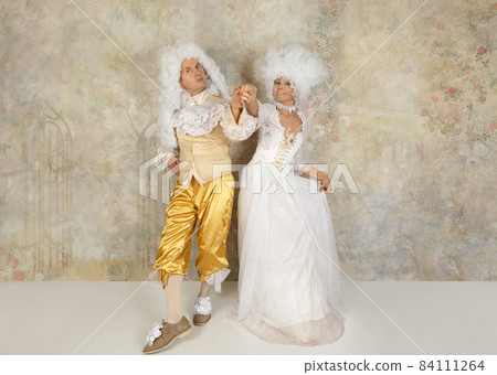 Studio shot of Baroque style couple in white wigs Studio shot of Baroque style couple in white wigs 84111264