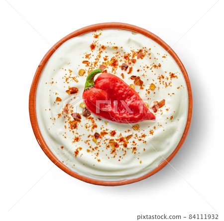bowl of hot dip yogurt sauce 84111932