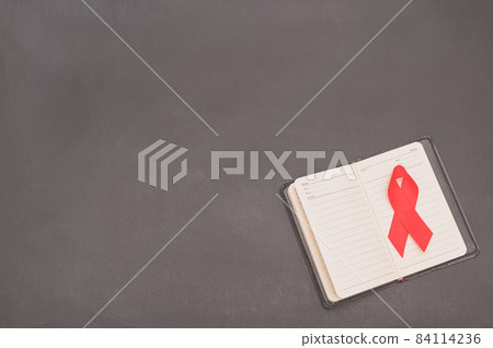 Red ribbon symbolizes world health day Red ribbon symbolizes world health day 84114236