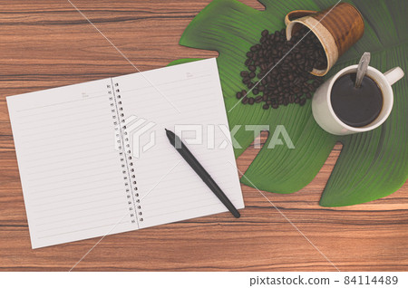 Notebooks and coffee mugs on the desk Notebooks and coffee mugs on the desk 84114489