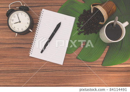 Notebooks and coffee mugs on the desk Notebooks and coffee mugs on the desk 84114491