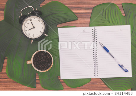 Notebook and coffee mug On the desk Notebook and coffee mug On the desk 84114493