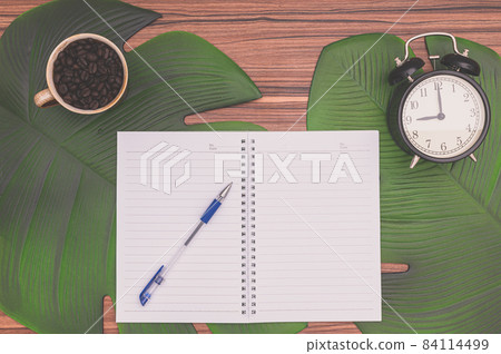 Notebook and coffee mug On the desk Notebook and coffee mug On the desk 84114499