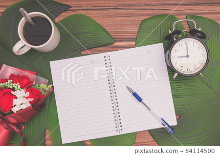Notebook and coffee mug On the desk Notebook and coffee mug On the desk 84114500