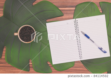 Notebook and coffee mug On the desk Notebook and coffee mug On the desk 84114502