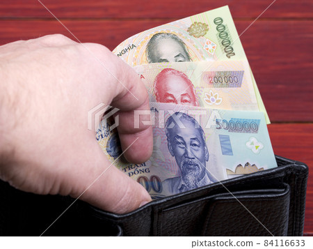Vietnamese money - dong in the black wallet Vietnamese money - dong in the black wallet 84116633