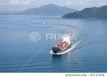 Image from diagonally above a container ship running on the sea Image from diagonally above a container ship running on the sea 84117936