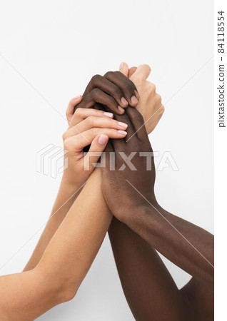 multiracial hands coming together 3. High quality beautiful photo concept multiracial hands coming together 3. High quality beautiful photo concept 84118554