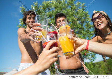 Content friends partying at poolside 84119038