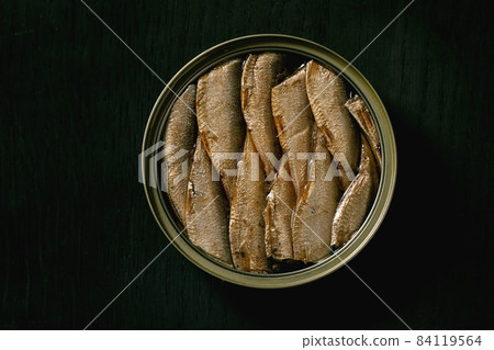 Open can with canned sprats in oil 84119564