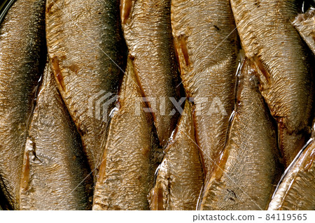 Open can with canned sprats in oil 84119565
